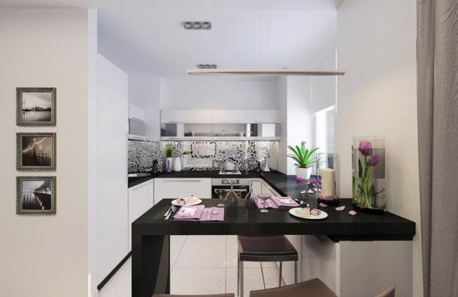 Завершує гарнітур барна стійка, яка за рахунок форми і чорного кольору відокремлює приміщення кухні від простору вітальні в квартирі-студії